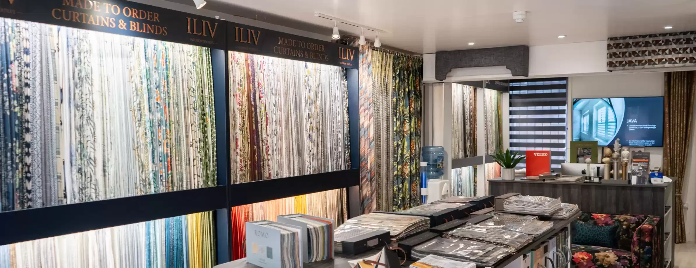 An image of Curtain Studio's Sheffield showroom, highlighting the different array of fabrics and colours.